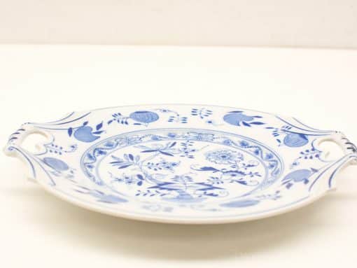 Elegant blue-and-white porcelain serving plate with floral designs and handles, perfect for any occasion.