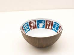 Vibrant decorative bowl with playful food illustrations and rustic wood grain design.