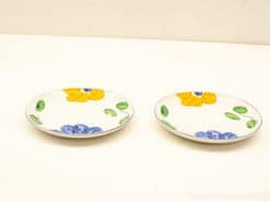 Colorful hand-painted ceramic plates perfect for cheerful dining and decorative table settings.