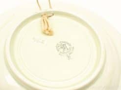 Elegant Italian ceramic plate with hanging twine and authentic manufacturers stamp, ideal for decoration.