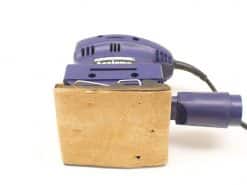 Compact purple orbital sander, ideal for DIY and professional sanding projects.