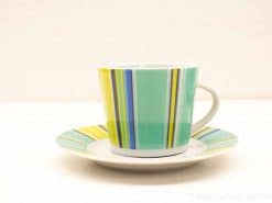 Stylish mint green and yellow striped tea set for enjoying hot beverages.