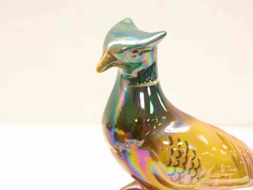 Iridescent vintage bird figurine, handcrafted glass with elegant details and vibrant colors.