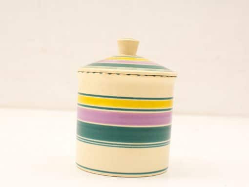 Colorful hand-painted ceramic container with lid, perfect for storage and home decor.