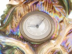 Iridescent vintage table clock with elegant design, showcasing artistic craftsmanship and natural elements.