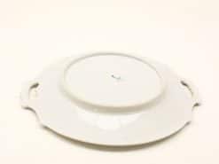 Elegant porcelain serving platter with handles and blue design, perfect for any dining occasion.