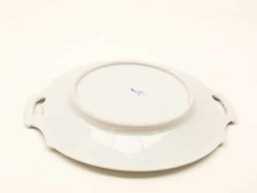 Elegant porcelain serving platter with handles and blue design, perfect for any dining occasion.