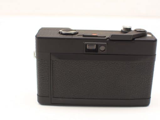 Elegant vintage camera with black leather-like texture and classic controls for analog photography enthusiasts.