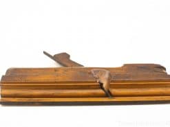 Vintage wooden hand plane showcasing craftsmanship, character, and rich history in woodworking.