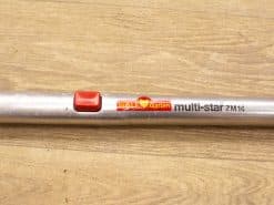 WOLF Garten Multi-Star extension pole with red button for versatile gardening tasks.