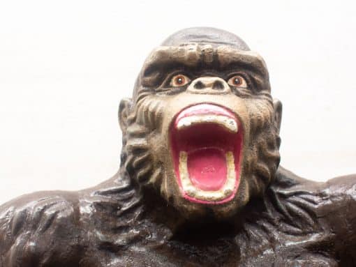 Majestic gorilla sculpture showcasing fierce expression and intricate details of power and realism.