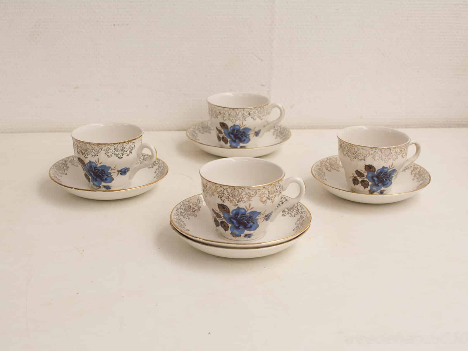 Antique teacups with floral designs and gold accents, perfect for elegant tea gatherings.