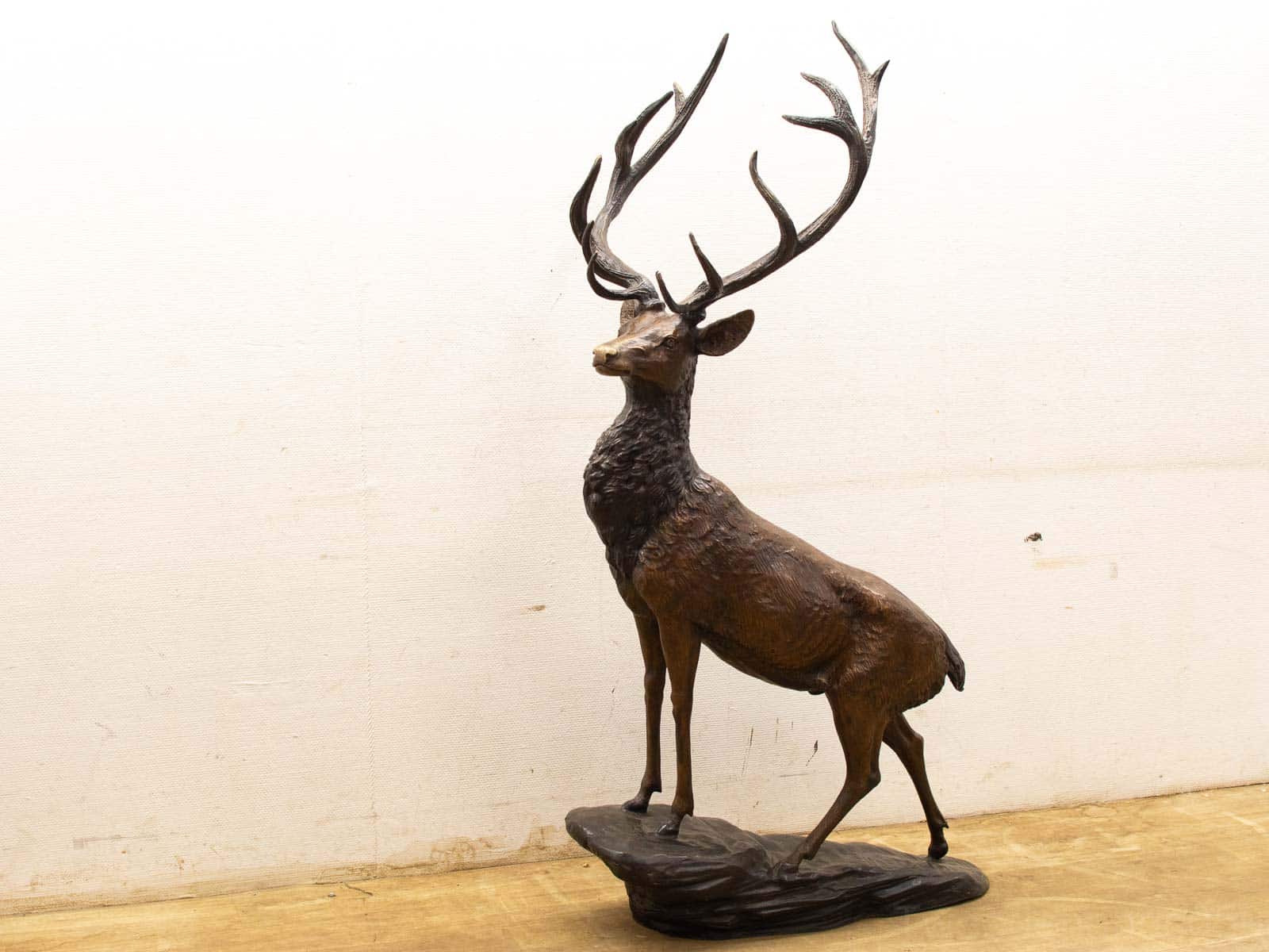 Elegant bronze stag sculpture showcasing intricate details and natural beauty. Perfect for any decor.