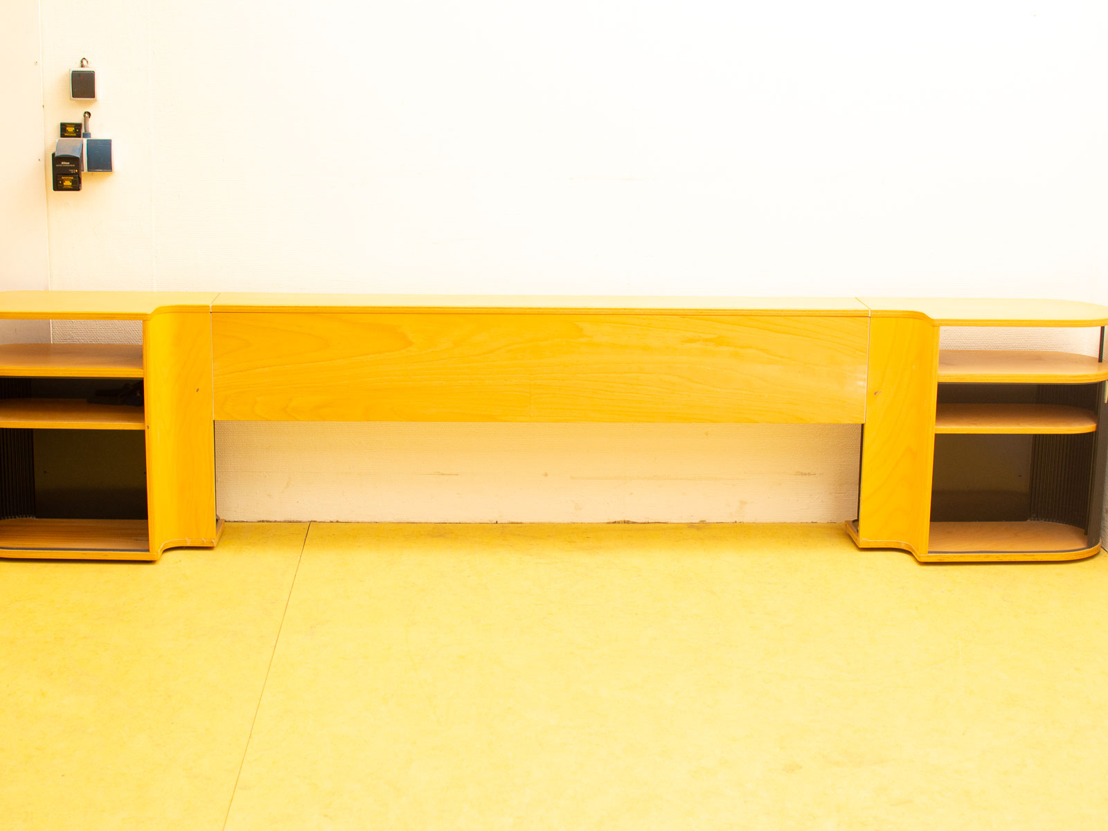 Sleek wooden media console with open shelves, perfect for modern living spaces and stylish storage.