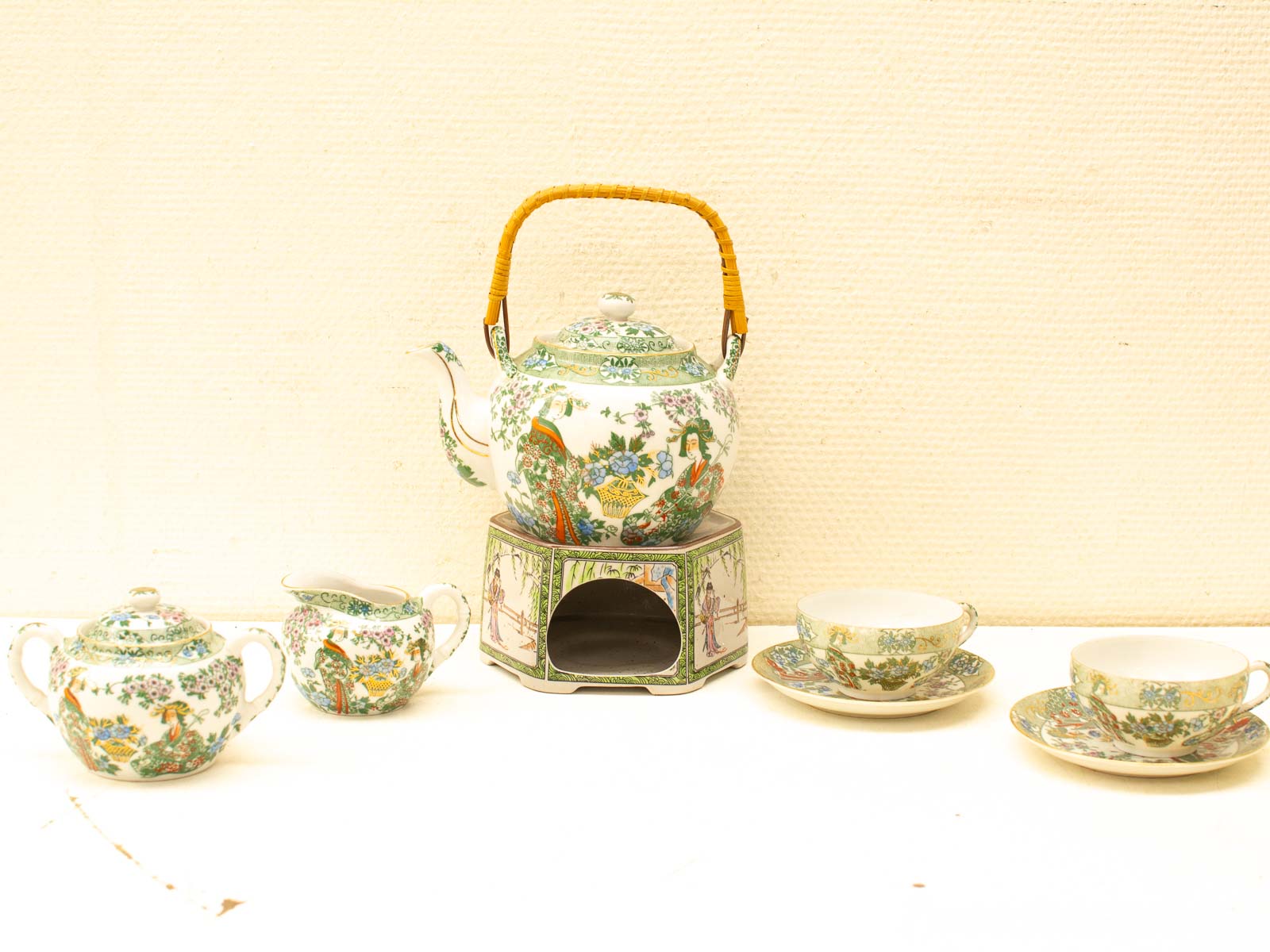 Elegant antique tea set with floral designs, perfect for timeless gatherings and delightful tea experiences.