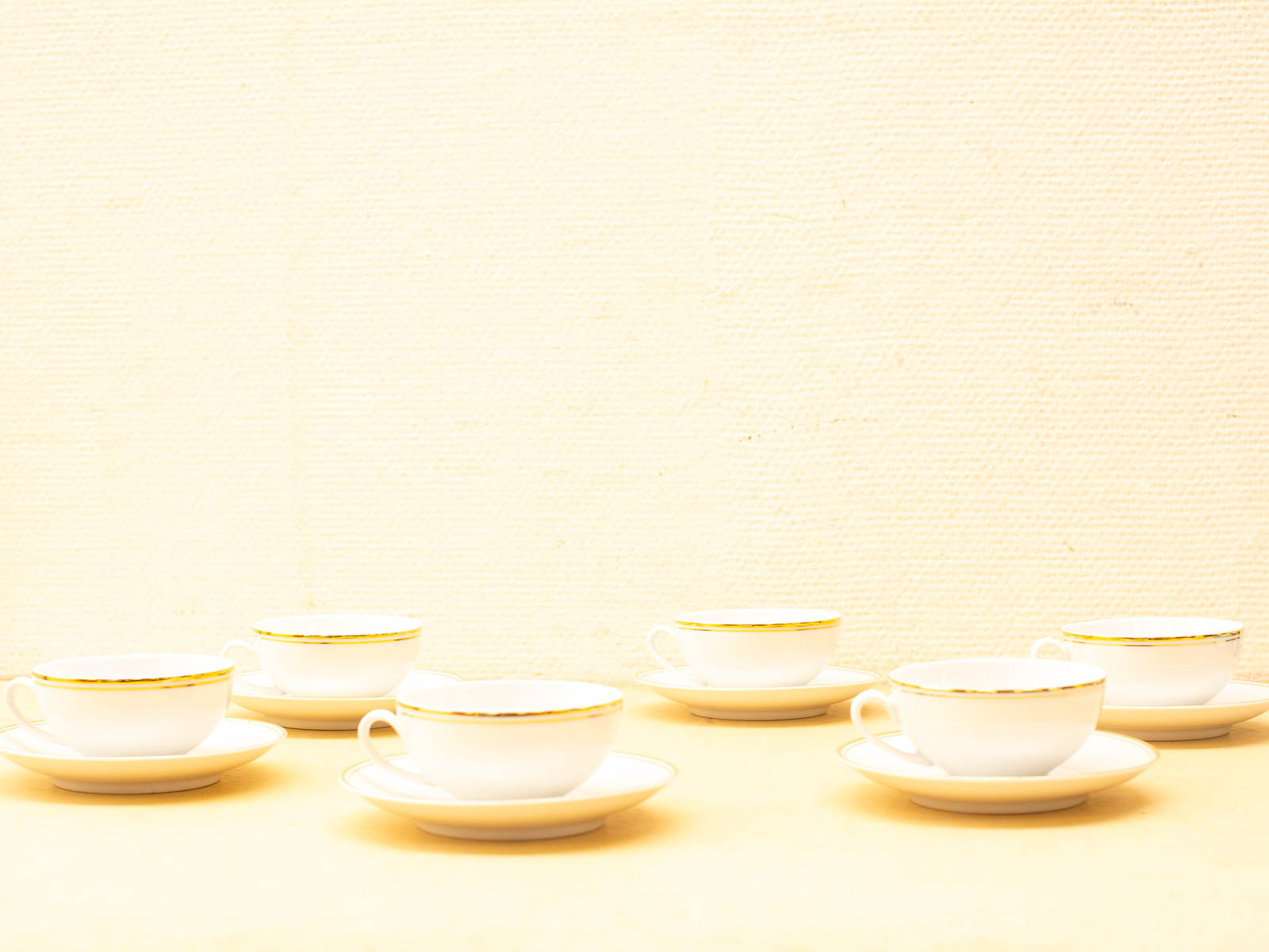 Elegant vintage porcelain teacups with gold accents, perfect for sophisticated tea gatherings.