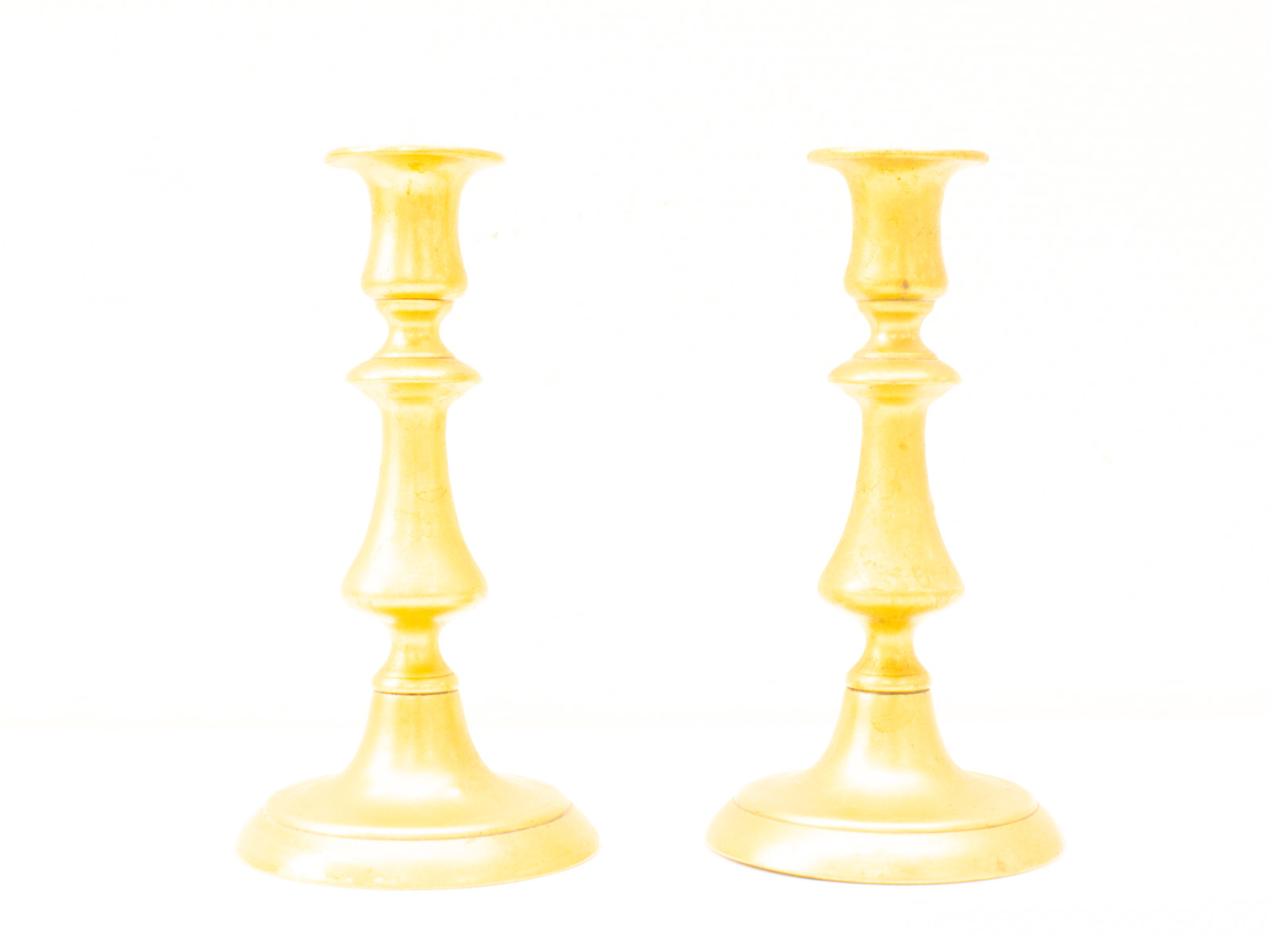 Elegant vintage gold candlestick set, perfect for stylish decor and ambient lighting.