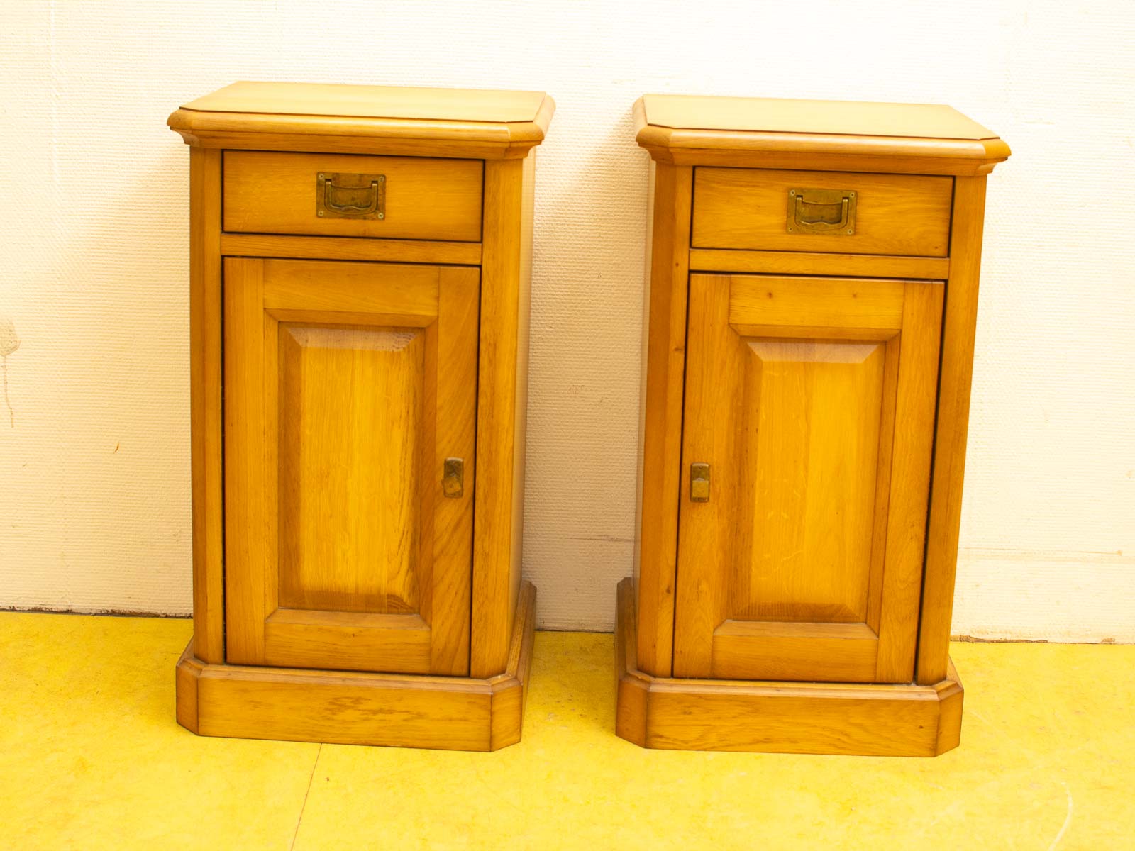 Stylish honey-colored wooden nightstands with vintage charm, ideal for enhancing any bedroom decor.