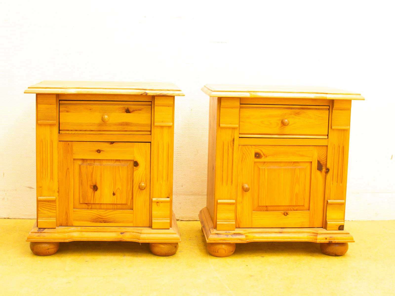 Vintage wooden nightstands in light honey hues, combining style and functionality for any bedroom decor.