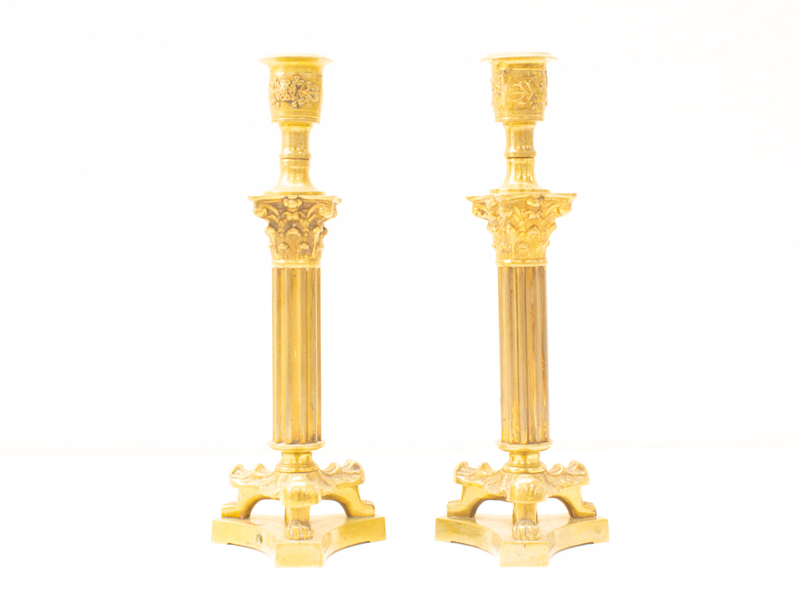 Elegant gold candlesticks with intricate designs, perfect for enhancing any decor and ambiance.