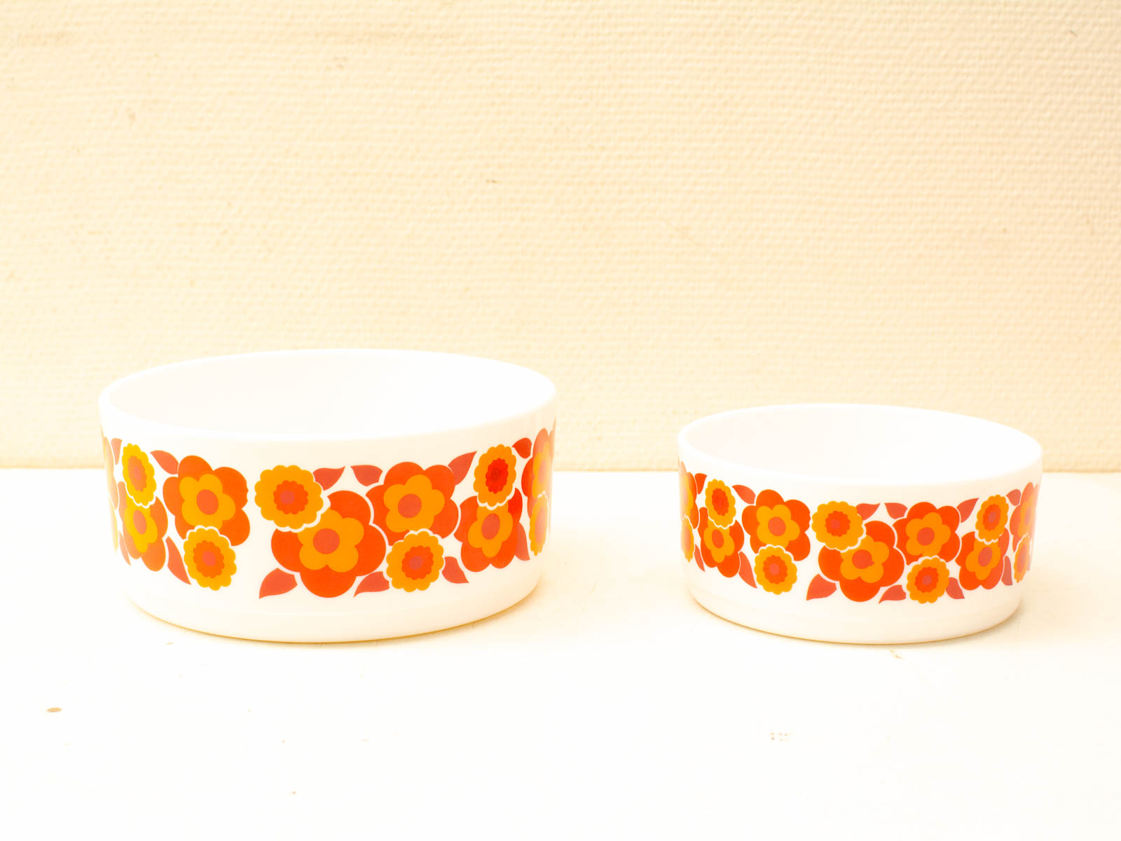 Charming retro ceramic bowls with vibrant floral designs, perfect for nostalgic dining decor.