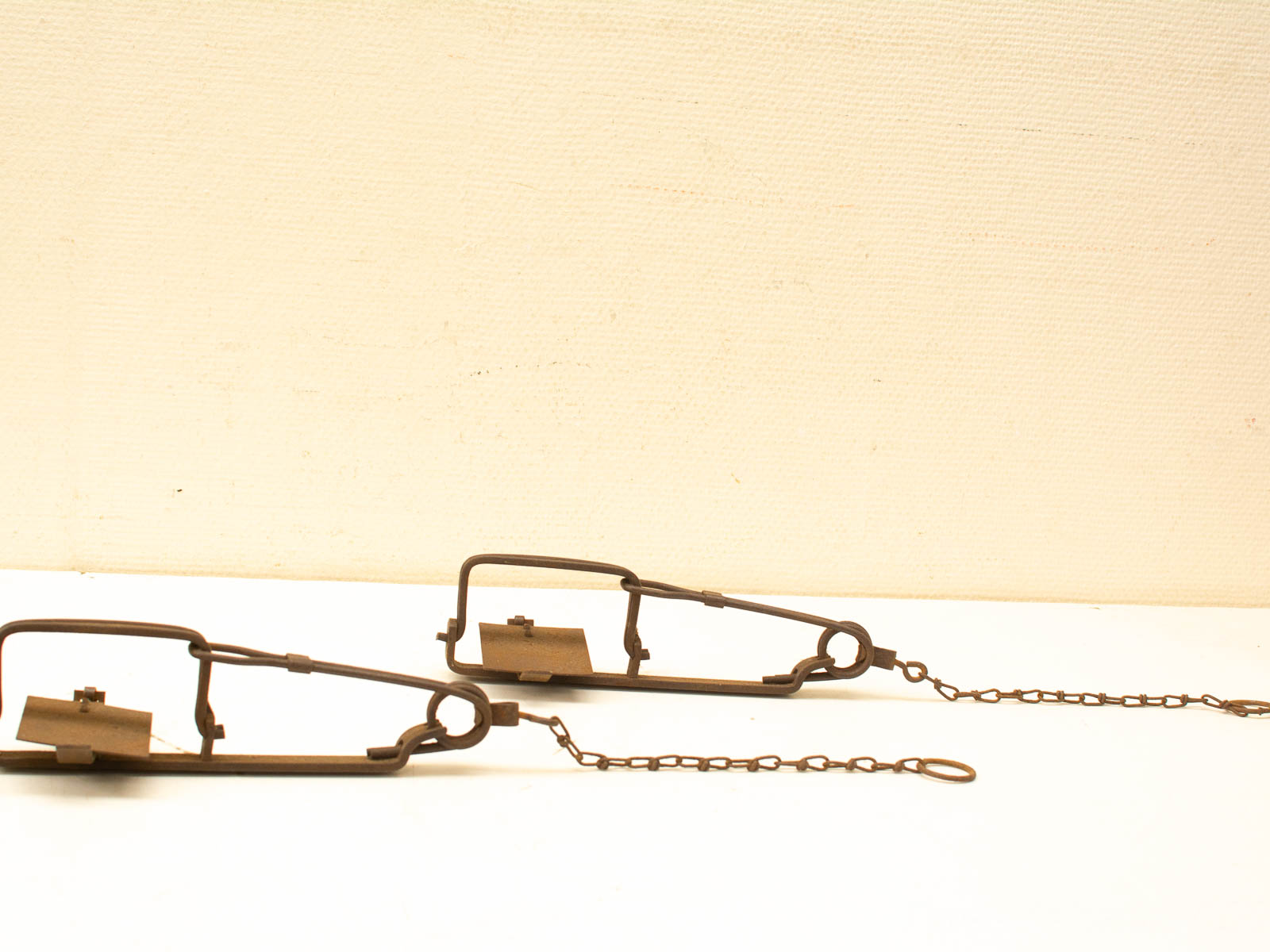 Vintage metal animal traps for hunting, featuring classic design and rustic charm.