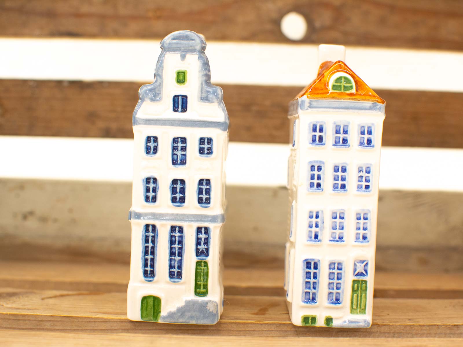 Charming decorative ceramic buildings with colorful roofs, perfect for whimsical home decor accents.