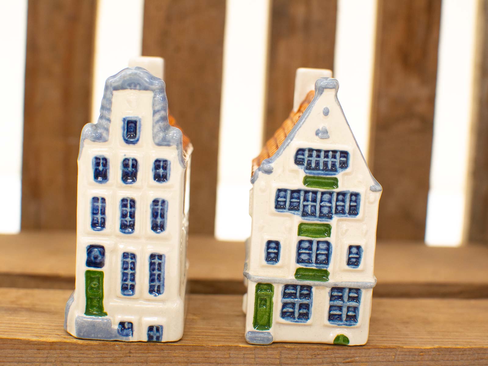 Charming ceramic houses inspired by Dutch architecture, showcasing vibrant glazes and intricate details.