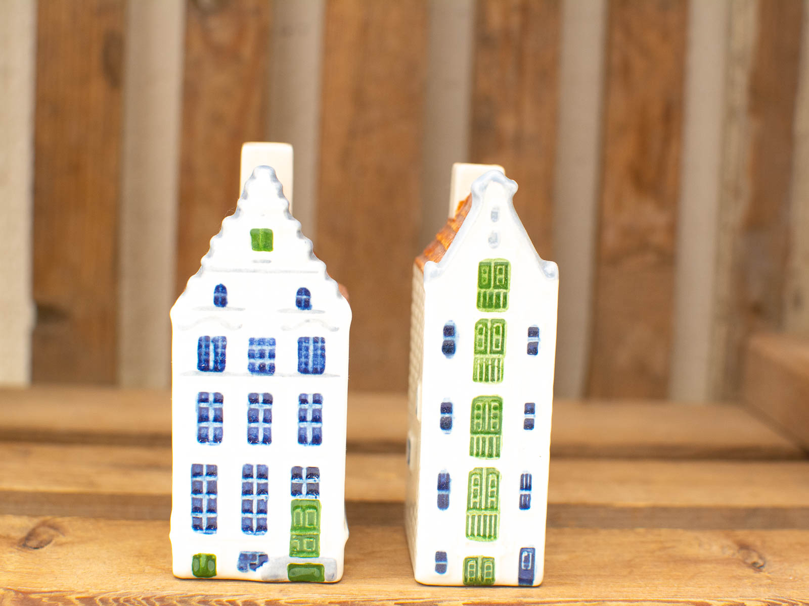 Charming vintage ceramic house decorations with vibrant colors and whimsical details for home décor.