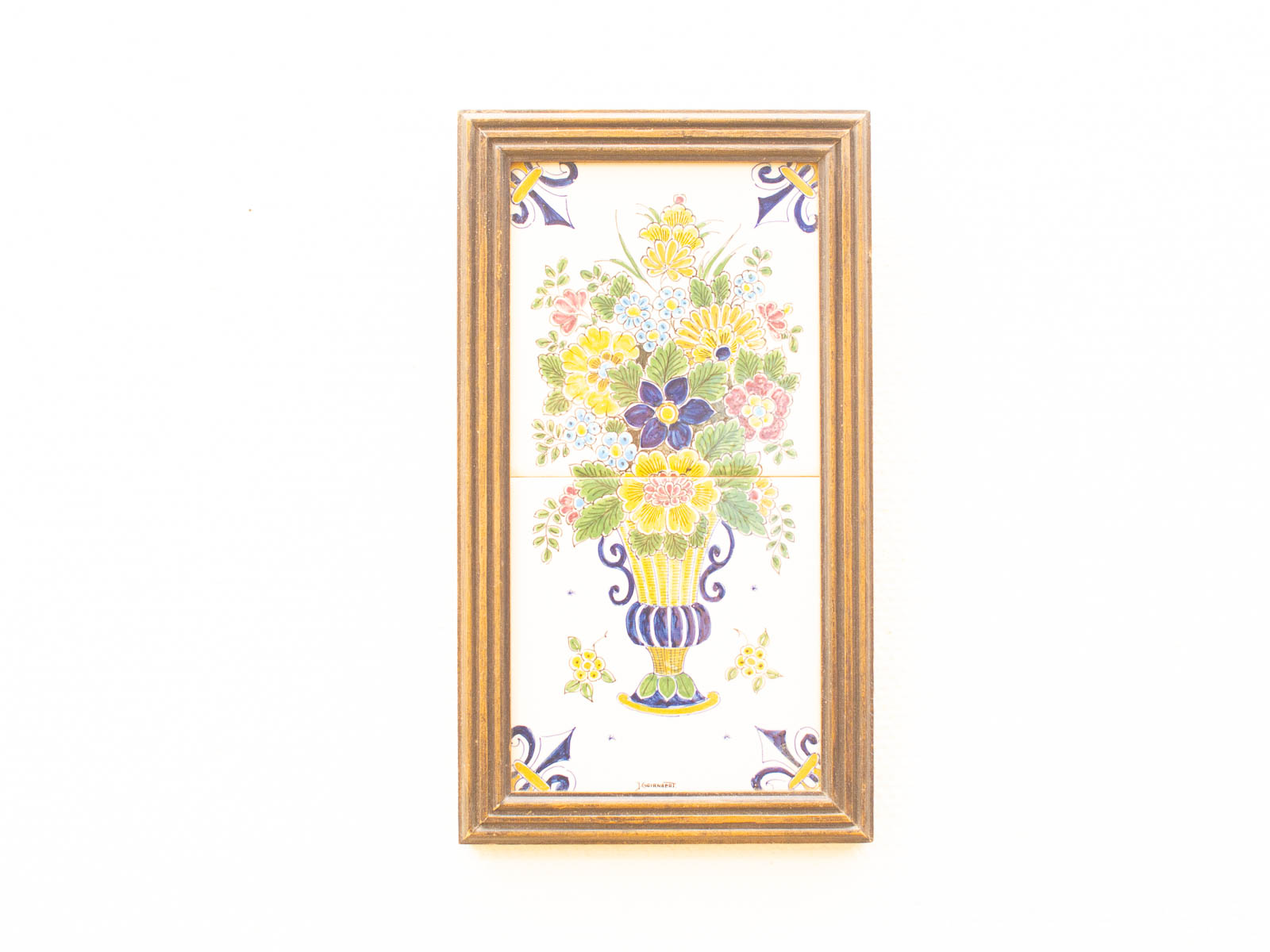 Vibrant vintage floral vase artwork in elegant wooden frame, perfect for home decor.