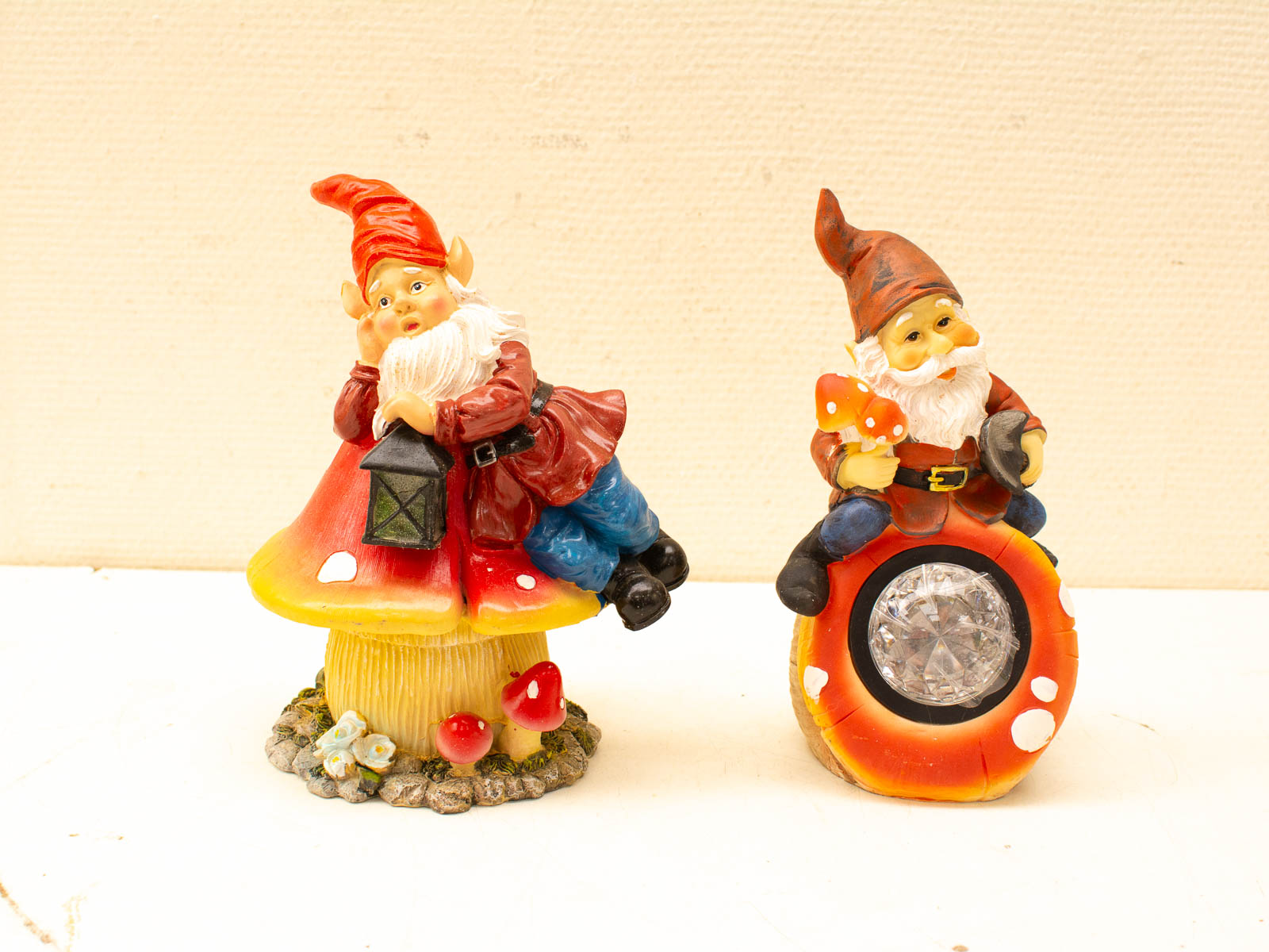 Whimsical garden gnomes on colorful mushrooms, adding charm and magic to any outdoor space.