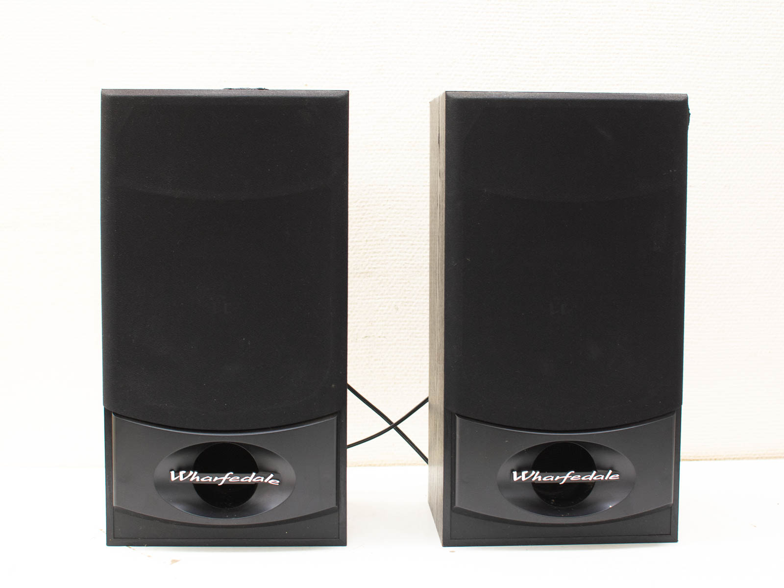 Sleek Wharfdale black speakers for immersive sound and modern decor in any space.