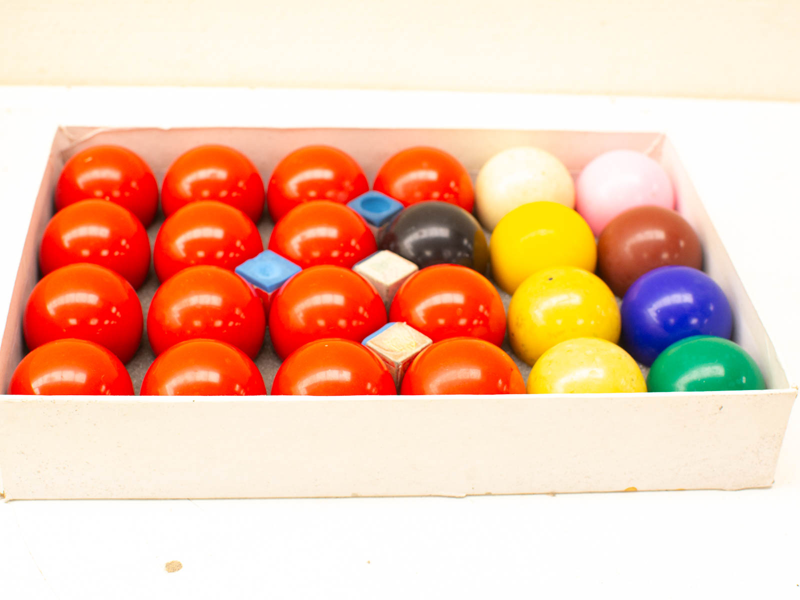 Colorful balls in a padded box for fun games and creative learning activities.