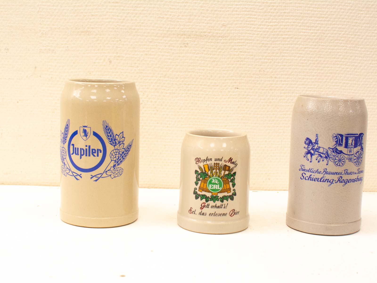 Unique vintage ceramic beer steins showcasing intricate designs and rich brewing heritage.