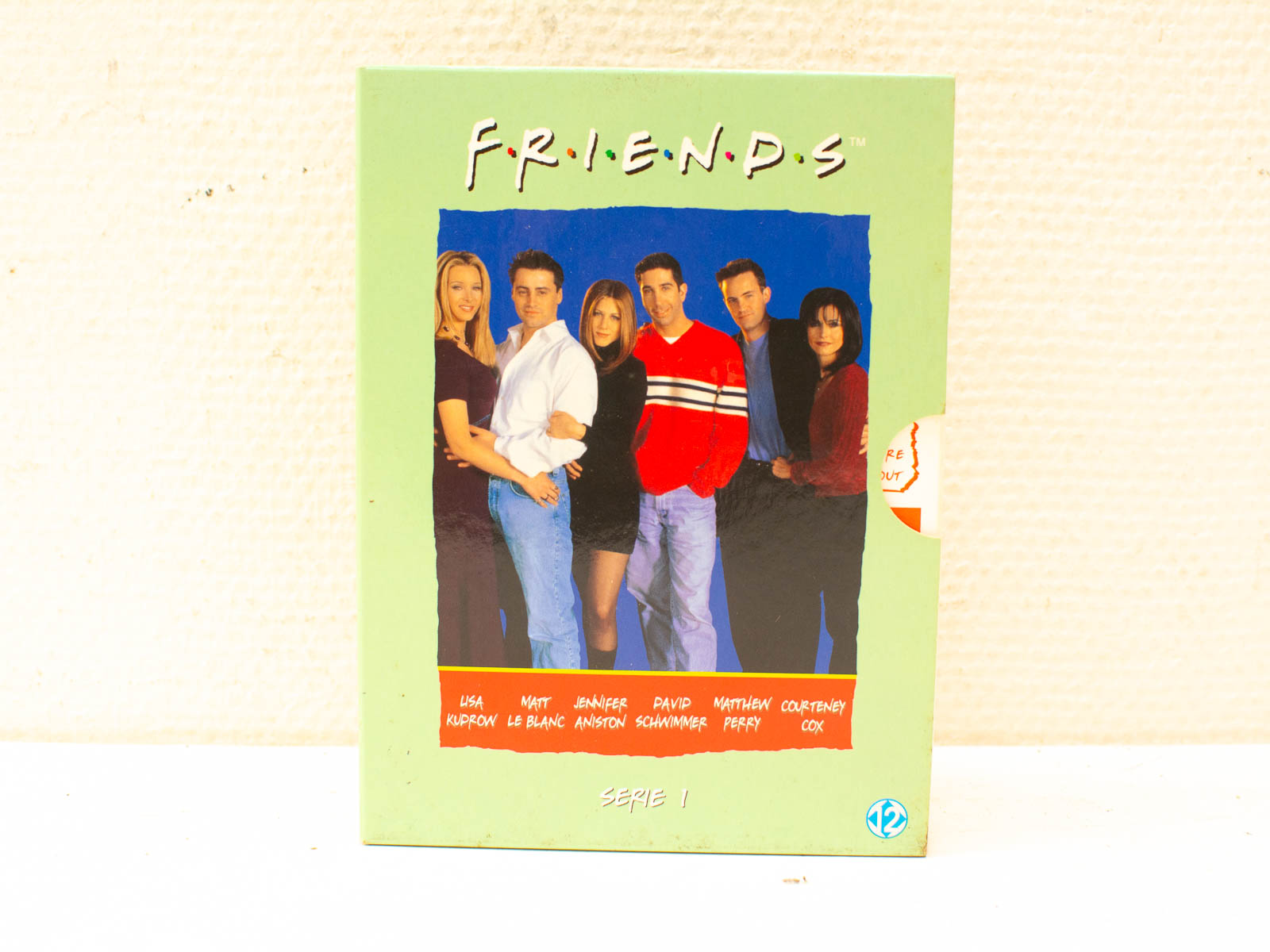 Colorful DVD box set of Friends Season 1, showcasing the iconic cast and friendship theme.