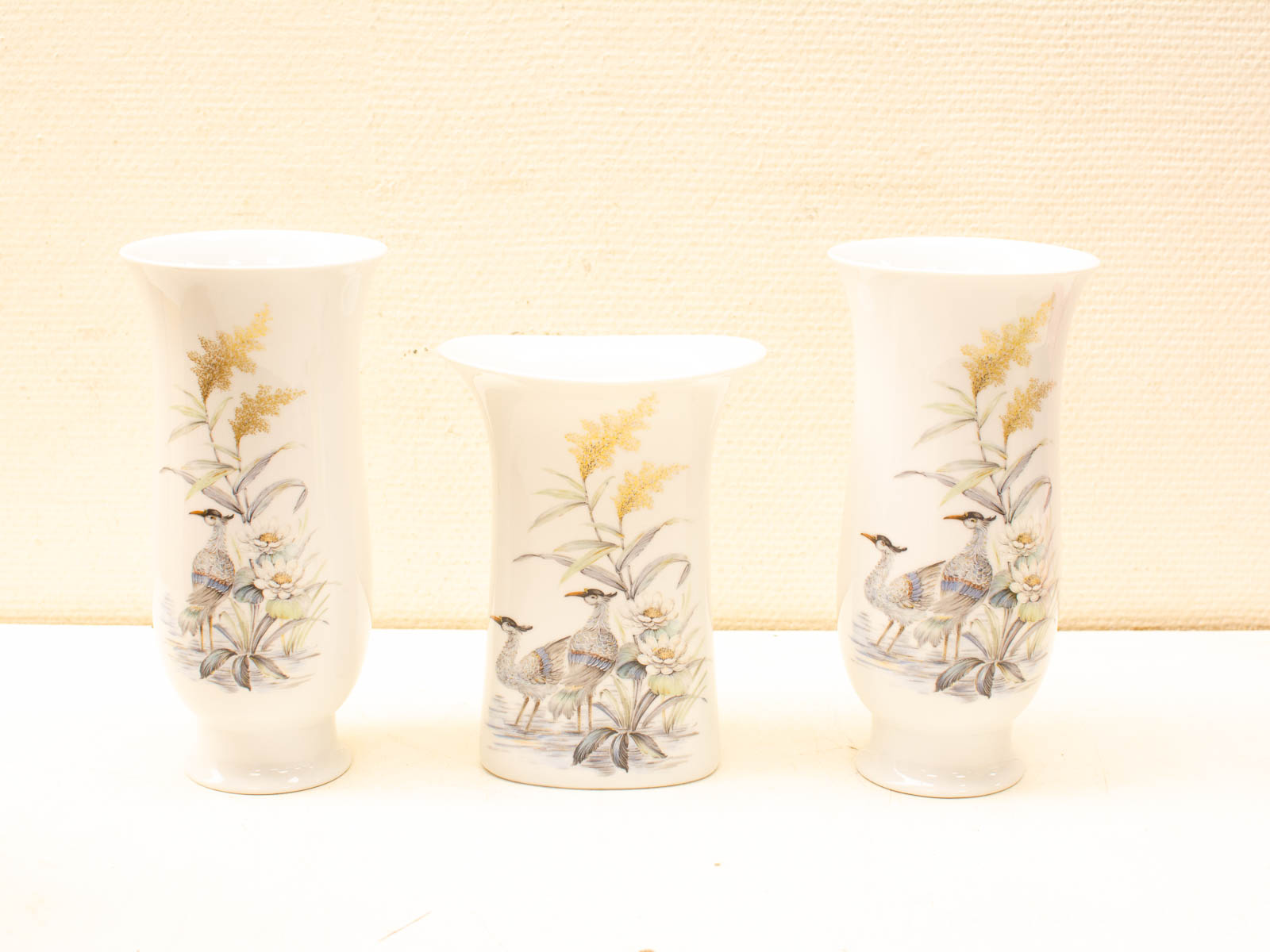 Elegant porcelain vases with bird and floral designs, perfect for home decor accents.