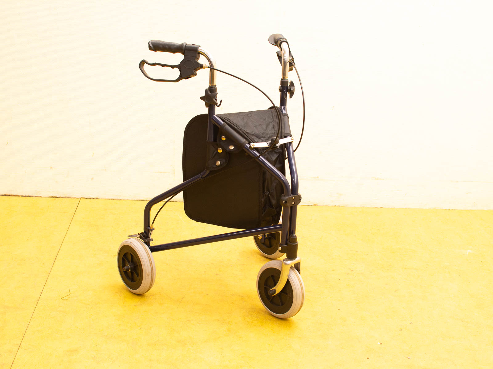 Sleek blue mobility walker with ergonomic handles, wheels, and a convenient fabric seat.