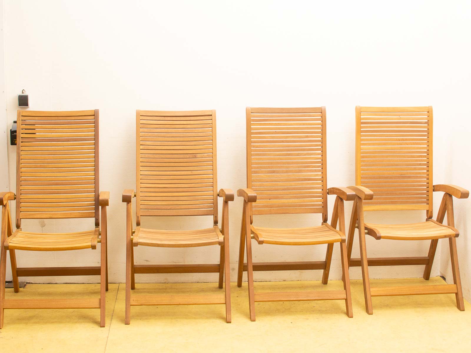 Cozy wooden slatted chairs perfect for casual settings, adding warmth and style to your space.