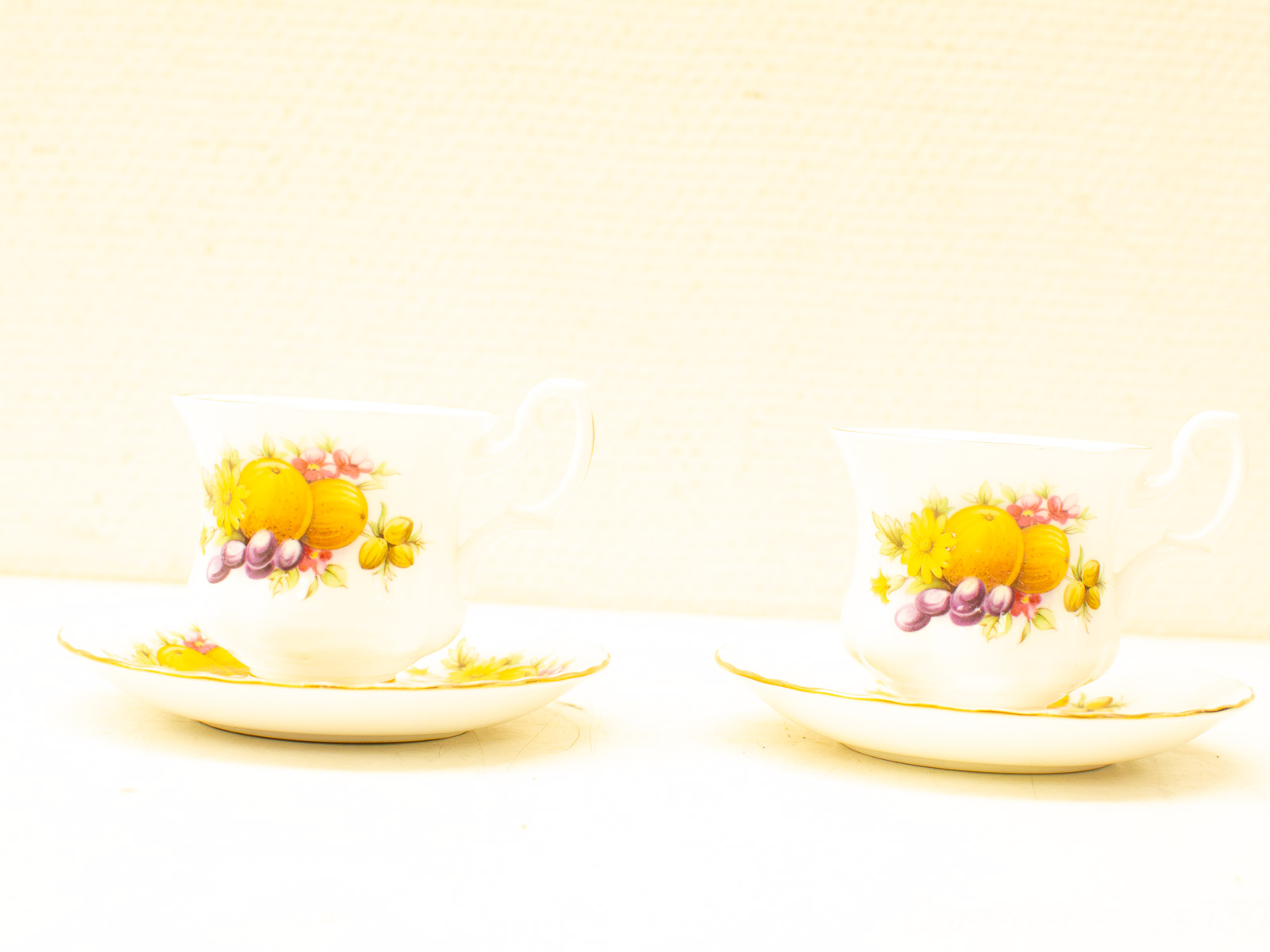 Elegant porcelain teacups with floral motifs, perfect for nostalgic afternoon tea gatherings.