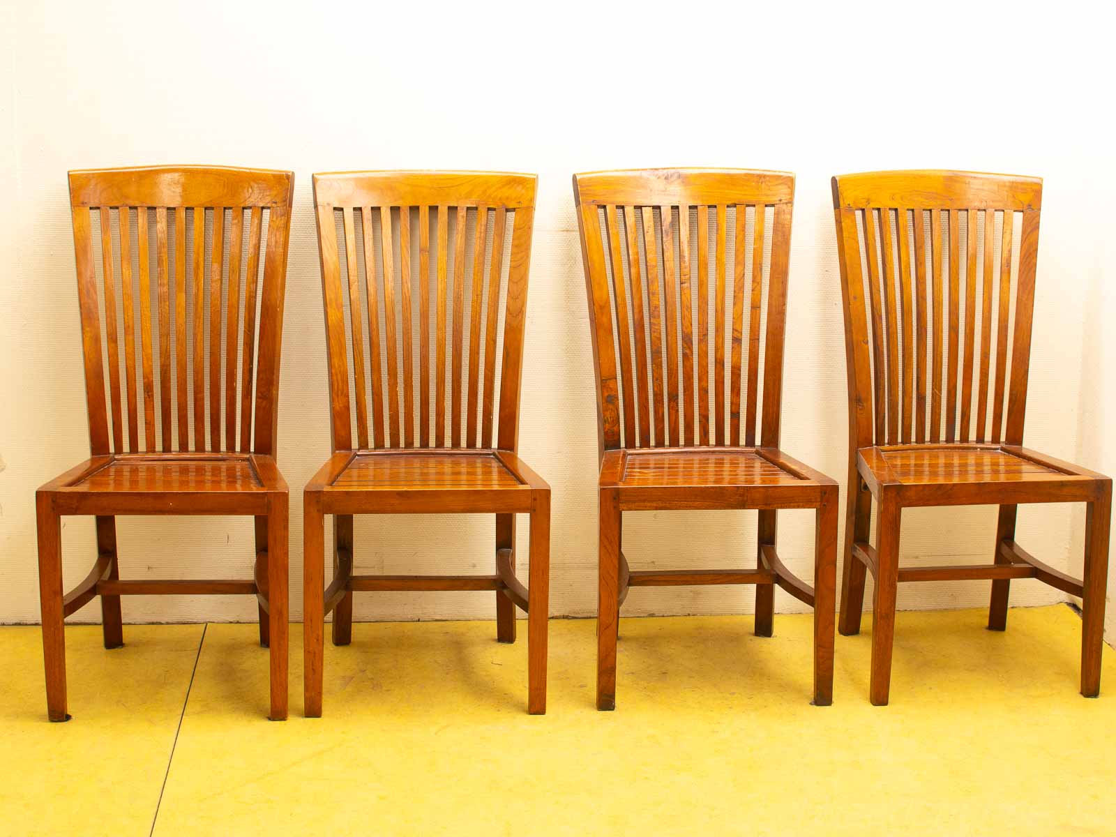 Elegant wooden chairs with slatted backs, perfect for dining or cozy spaces.