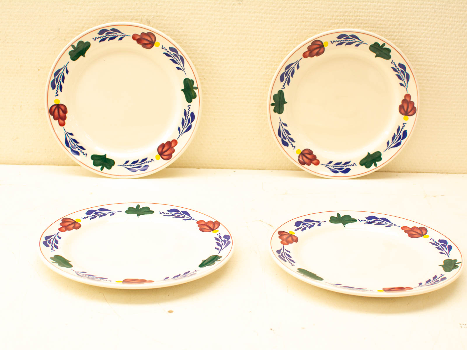 Vibrant vintage floral plates, perfect for any occasion, blending functionality with cheerful charm.