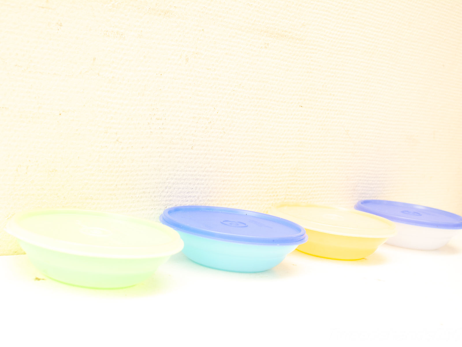 Vibrant round food containers for stylish organization and fresh food storage in the kitchen.