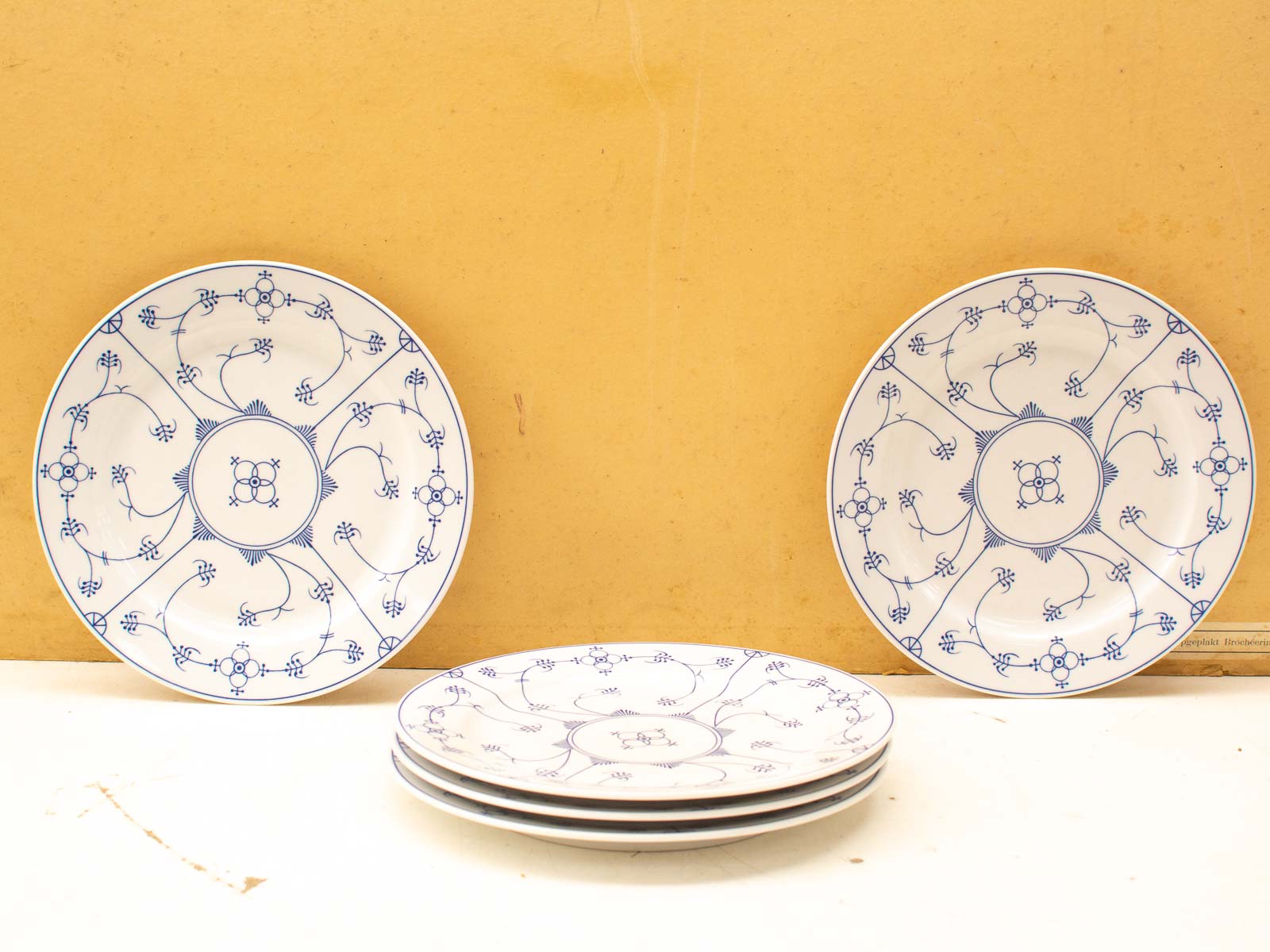 Elegant blue and white ceramic plates with intricate floral designs for sophisticated table settings.