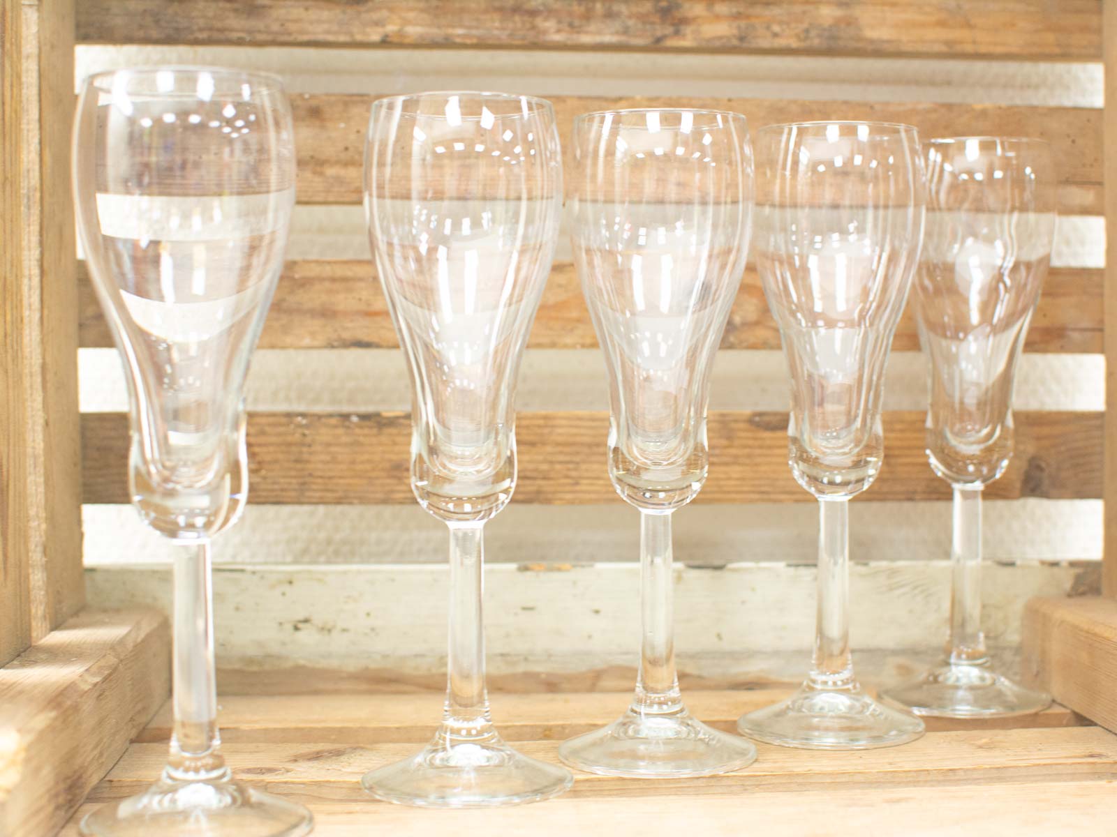 Elegant crystal glasses on rustic wood, perfect for celebrations and special occasions.