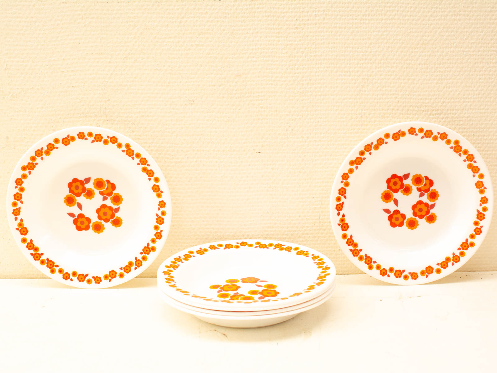 Charming vintage floral plates set with vibrant designs for a warm, inviting home atmosphere.