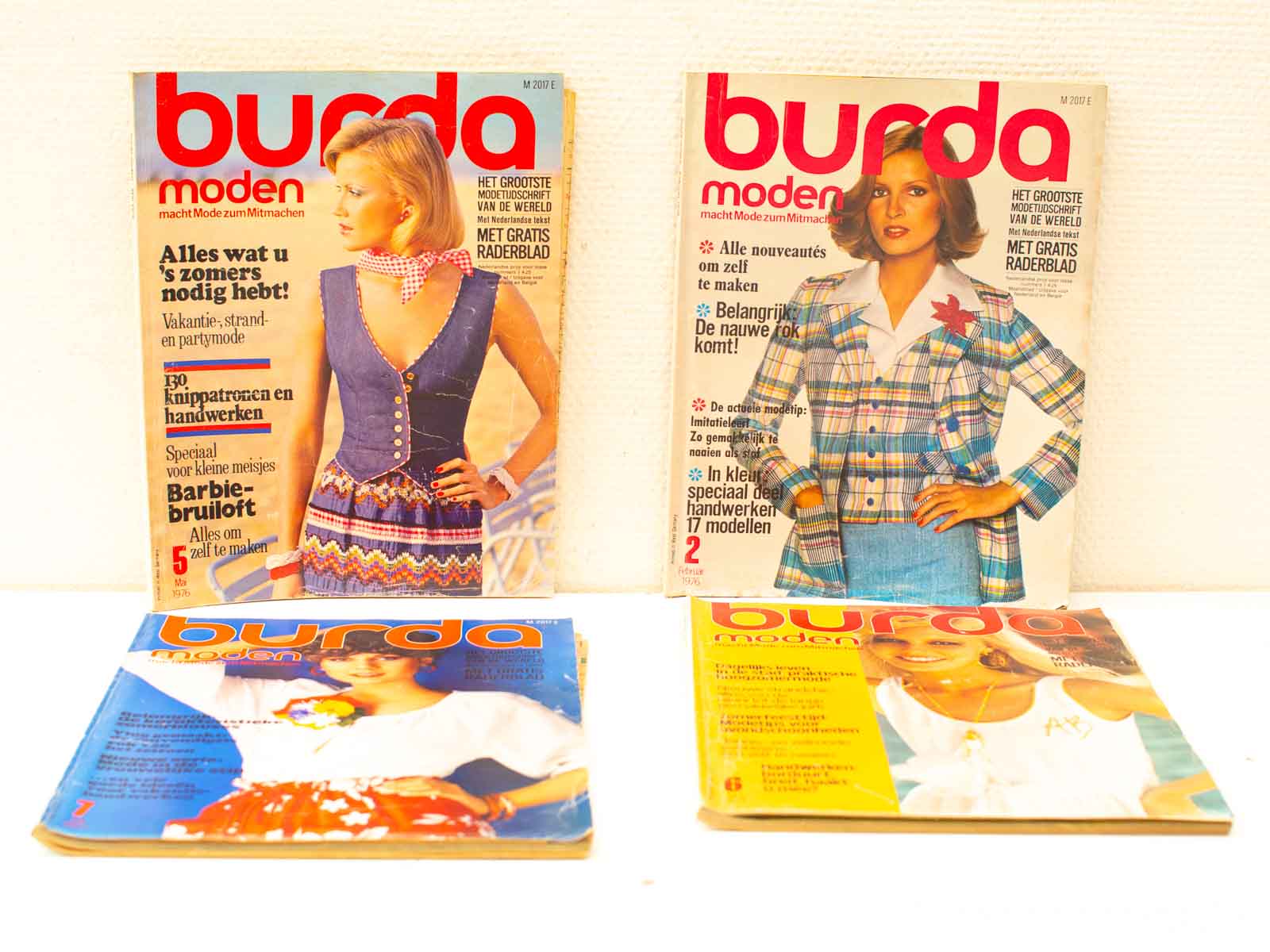 1970s vintage Burda Moden magazines featuring fashion trends, DIY patterns, and stylish outfits.