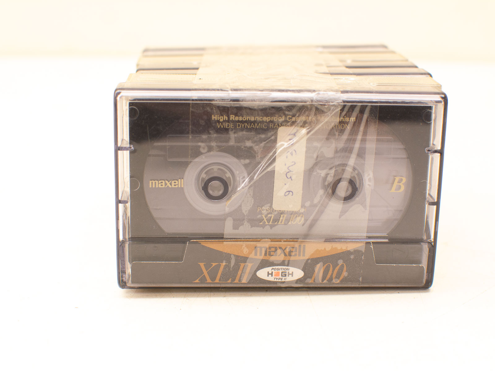 Vintage Maxell XL-II 100 cassette tape in case, showcasing classic design and nostalgic appeal.