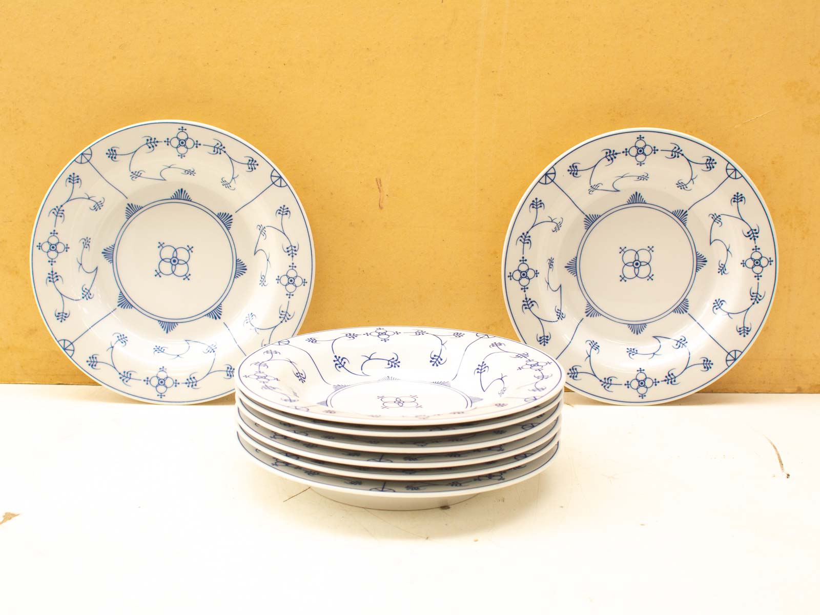 Elegant blue-and-white decorative plates with intricate designs for timeless dining experiences.