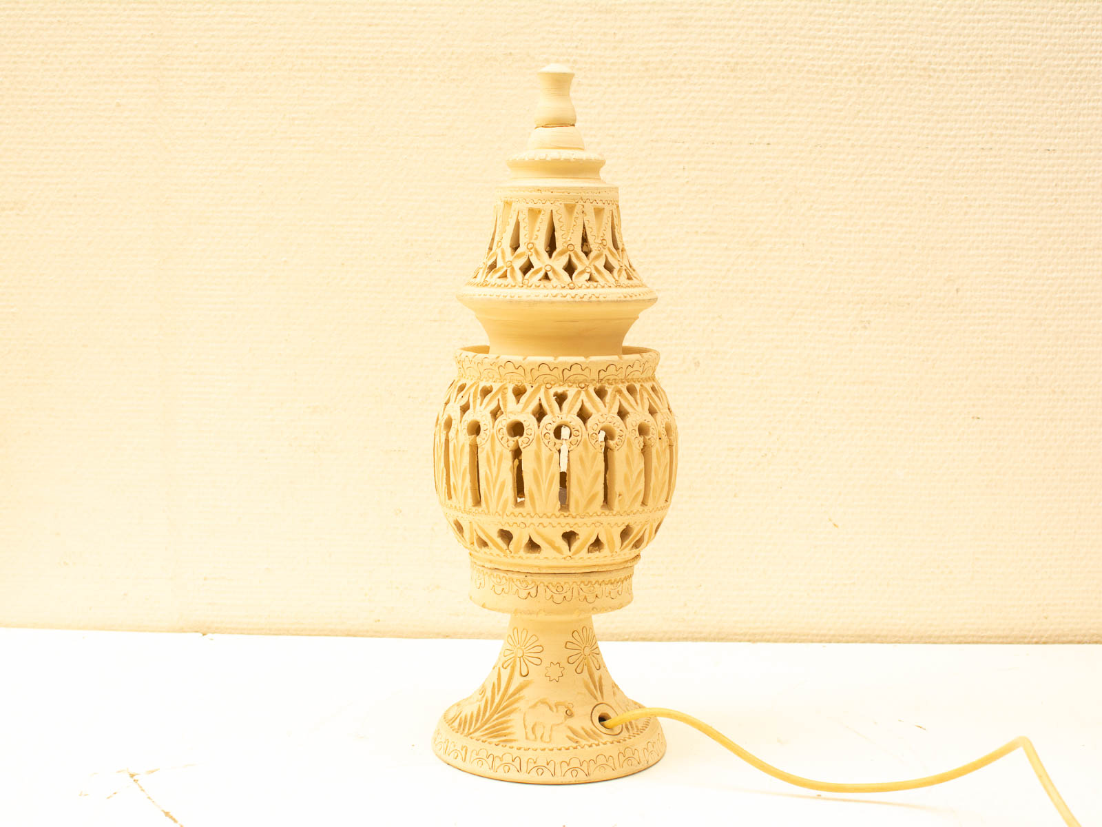 Intricate vintage lamp with geometric patterns, blending traditional artistry and modern functionality.