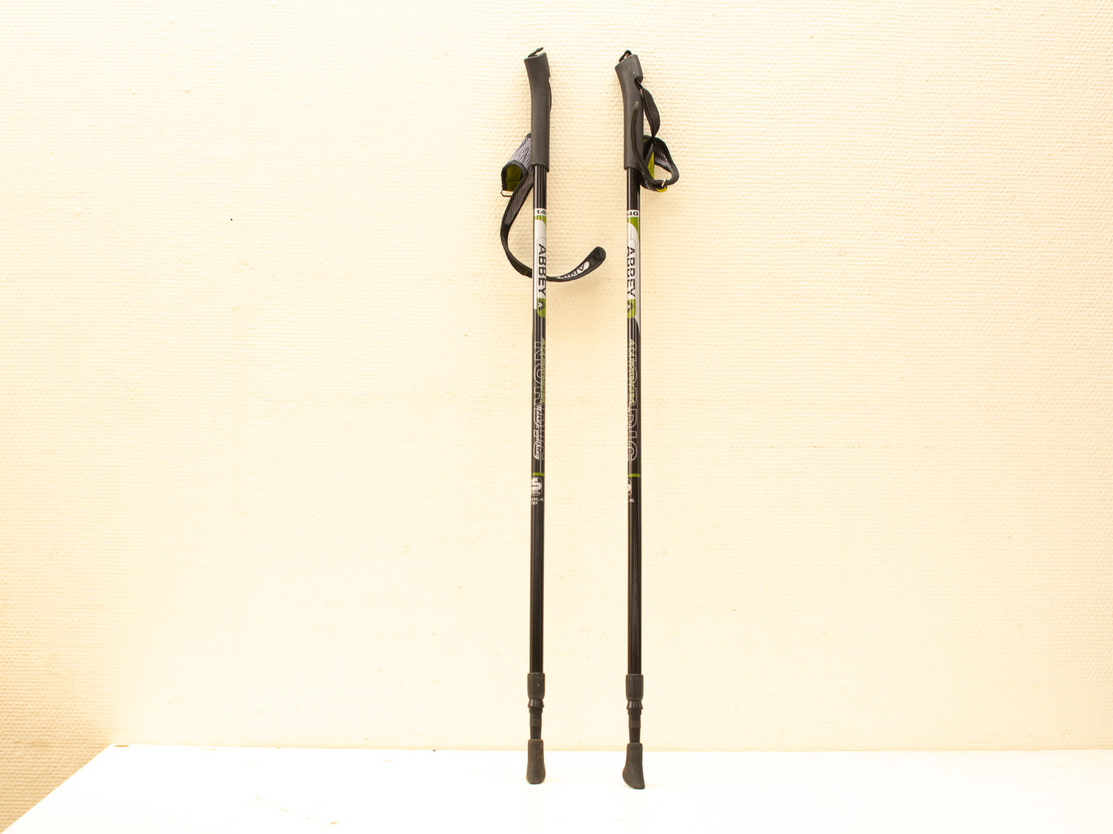 Sleek black vintage trekking poles with ergonomic grips for comfortable outdoor adventures.